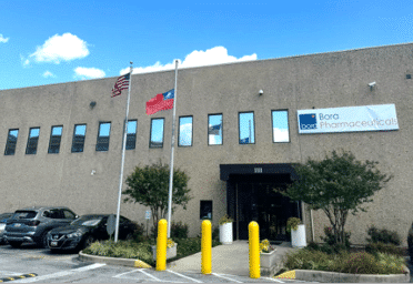 Bora Pharmaceuticals Baltimore, MD pharmaceutical manufacturing facility exterior view.